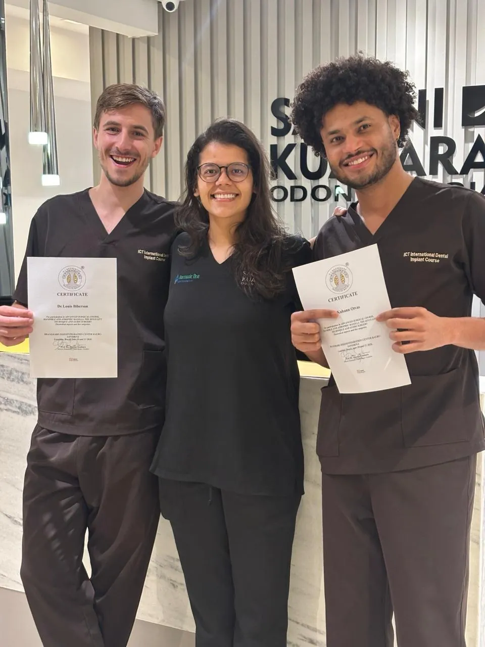 Mentees receiving their course certificates at the clinic